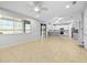 Bright and open living room with tile flooring and view of the backyard at 9307 Raes Creek Pl, Palmetto, FL 34221