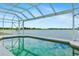 The pool's surface reflects an open sky and offers serene waterfront views at 9307 Raes Creek Pl, Palmetto, FL 34221