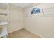 Walk-in closet with shelving, carpet, and window for convenience and organization at 9307 Raes Creek Pl, Palmetto, FL 34221