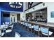 Upscale bar with granite counters, stylish seating, and views of the golf course at 9320 Clubside Cir # 2208, Sarasota, FL 34238