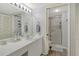 Bright bathroom featuring a walk-in shower and single sink vanity at 9320 Clubside Cir # 2208, Sarasota, FL 34238