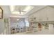 Kitchen features white appliances, wood-look floors and a ceiling fan at 9320 Clubside Cir # 2208, Sarasota, FL 34238