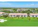 Residential buildings overlooking a beautiful green golf course in a serene community at 9641 Castle Point Dr # 1215, Sarasota, FL 34238