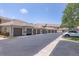 Row of residential garages with brown doors; complex name and number signs visible at 9641 Castle Point Dr # 1215, Sarasota, FL 34238