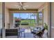 Relaxing lanai offers comfortable seating with serene views of lush greenery and a manicured golf course at 9641 Castle Point Dr # 1215, Sarasota, FL 34238