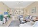 Open-concept living room with tile floors, access to dining area, and golf course view at 9641 Castle Point Dr # 1215, Sarasota, FL 34238