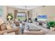 Comfortable living room featuring a large window, stylish furniture, and a relaxing atmosphere at 9641 Castle Point Dr # 1215, Sarasota, FL 34238