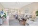 Cozy living room with neutral tones, open floor plan, and golf course views at 9641 Castle Point Dr # 1215, Sarasota, FL 34238