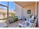 Relaxing screened-in patio with comfortable seating and a serene view of the surrounding greenery at 9641 Castle Point Dr # 1215, Sarasota, FL 34238