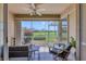 Relaxing sunroom with a ceiling fan and picturesque view at 9641 Castle Point Dr # 1215, Sarasota, FL 34238