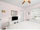 Bright bedroom features a neutral color palette, ceiling fan, and ample storage at 1108 65Th W Ave, Bradenton, FL 34207