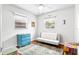 Bright bedroom featuring two windows, a comfy futon, and an accent rug that brings a lively and fresh touch at 1108 65Th W Ave, Bradenton, FL 34207