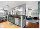 Kitchen with dark countertops, backsplash, tile floors and an open layout to living spaces at 1108 65Th W Ave, Bradenton, FL 34207