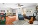 Inviting living room with hardwood floors, ceiling fans, and direct access to outdoor patio, offering versatile living at 1108 65Th W Ave, Bradenton, FL 34207
