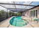 Private pool area with a screened enclosure and access to an outdoor patio at 1108 65Th W Ave, Bradenton, FL 34207