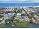 Breathtaking aerial view of coastal property with beachfront access and serene waterfront views, perfect for luxury living at 1255 E Peppertree Dr # 506, Sarasota, FL 34242