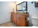 Bathroom with tan vanity, granite countertop, and ample storage space at 1255 E Peppertree Dr # 506, Sarasota, FL 34242