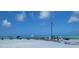 A beach with clear turquoise water, white sand, and clear skies is ideal for relaxing with friends and Gathering at 1255 E Peppertree Dr # 506, Sarasota, FL 34242