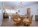 Bright dining area features a glass table, four woven chairs and tile flooring at 1255 E Peppertree Dr # 506, Sarasota, FL 34242