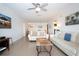 Inviting living room with tile flooring, comfortable seating and view into other living areas at 1255 E Peppertree Dr # 506, Sarasota, FL 34242