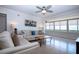 Bright living room features large windows with water views and comfortable seating area at 1255 E Peppertree Dr # 506, Sarasota, FL 34242