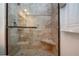 Detailed tile shower with built-in seat and frameless glass enclosure at 1255 E Peppertree Dr # 506, Sarasota, FL 34242