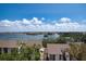 A picturesque view of the inter coastal from the rooftop, showcasing a serene waterfront setting at 1255 E Peppertree Dr # 506, Sarasota, FL 34242