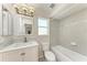 Bright bathroom featuring a tiled shower over tub and modern vanity at 1323 Arredondo St, North Port, FL 34286