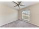Neutral bedroom with a modern ceiling fan and a view to the outdoors at 1323 Arredondo St, North Port, FL 34286