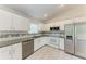 Bright kitchen with stainless steel appliances and modern white cabinetry at 1323 Arredondo St, North Port, FL 34286