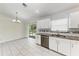 Updated kitchen with stainless steel appliances and sliding door to the backyard at 1323 Arredondo St, North Port, FL 34286
