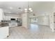 Bright living area with tile flooring and access to kitchen and entry foyer at 1323 Arredondo St, North Port, FL 34286