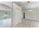Open living room and dining area with large windows and neutral tile flooring at 1323 Arredondo St, North Port, FL 34286