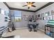 Bedroom featuring gray walls, carpet, and drum set at 13409 Ramblewood Trl, Bradenton, FL 34211
