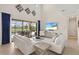 Bright living room with vaulted ceilings, sliding glass doors to lanai and a television with streaming service at 13409 Ramblewood Trl, Bradenton, FL 34211