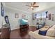 Cozy living room with dark hardwood floors, light blue walls and comfortable furniture at 13409 Ramblewood Trl, Bradenton, FL 34211