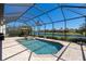 Screened-in pool and spa overlooking the canal and the neighborhod at 13409 Ramblewood Trl, Bradenton, FL 34211