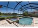 Screened-in pool and spa overlooking the canal and the neighborhod at 13409 Ramblewood Trl, Bradenton, FL 34211