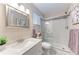 Updated bathroom with marble vanity, frameless shower, and modern fixtures at 1520 Lakeside Way # 147, Sarasota, FL 34232