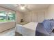 Cozy bedroom featuring a ceiling fan, neutral walls, and double closets at 1520 Lakeside Way # 147, Sarasota, FL 34232