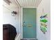 Inviting entryway with a stylish door and beach-themed decor adding coastal charm at 1520 Lakeside Way # 147, Sarasota, FL 34232