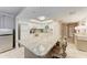 Bright kitchen with granite countertops, stainless steel appliances, and an island with seating at 1520 Lakeside Way # 147, Sarasota, FL 34232