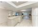 Spacious kitchen with an island that offers a view into the living spaces at 1520 Lakeside Way # 147, Sarasota, FL 34232
