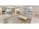 Open-concept living room with a large rug, sectional sofa, and plenty of natural light at 1520 Lakeside Way # 147, Sarasota, FL 34232