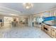 Spacious living room seamlessly connected to kitchen and sunroom at 1520 Lakeside Way # 147, Sarasota, FL 34232