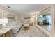 Comfortable living room with a large sectional sofa, modern decor, and sliding glass doors at 1520 Lakeside Way # 147, Sarasota, FL 34232