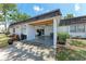 View of the home's convenient covered parking area with ample space and storage at 1520 Lakeside Way # 147, Sarasota, FL 34232