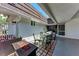 Covered patio with outdoor seating, barbecue, and a fire pit for relaxing evenings at 1520 Lakeside Way # 147, Sarasota, FL 34232