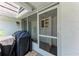View of the home's porch with a barbecue grill, providing a perfect spot for outdoor cooking at 1520 Lakeside Way # 147, Sarasota, FL 34232