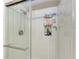 Bright shower with white tile, inset shelf, and modern fixtures at 1520 Lakeside Way # 147, Sarasota, FL 34232